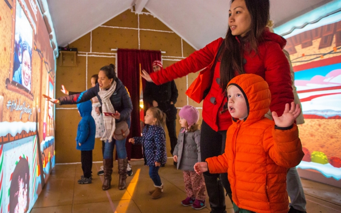 Children and parents viewing the Gingerbread BLVD experience